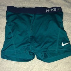 teal nike pros
